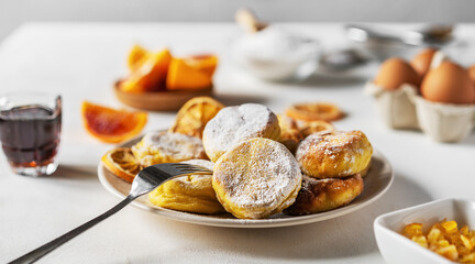Cottage cheese pancakes with ingredients: gluten free flour, maple syrup, oranges' peels, eggs