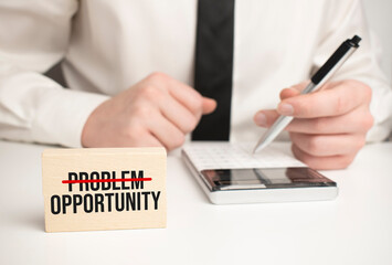 Calculator pen and businessman. Problem Opportunity concept