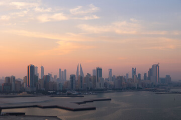 Naklejka na ściany i meble Manama city skyline at sunset in the Gulf country of Bahrain 
