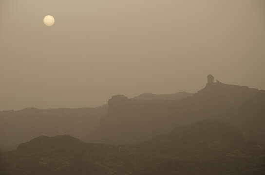 Roque Nublo at dawn on a day of airbone dust. The Nublo Rural Park. Tejeda. Gran Canaria. Canary Islands. Spain.