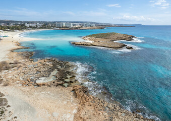 Aerial drone view of the coastline of empty beach in winter. Summer holidays. Nissi beach Ayia Napa, Cyprus