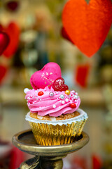 Colorful decorated cupcakes  for sale on candy shop to celebrate Happy Valentine's Day