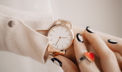 Beautiful stylish white watch on woman hand - obrazy, fototapety, plakaty