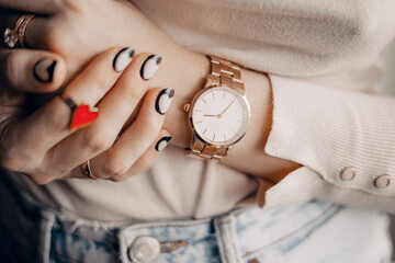 Elegant beautiful stylish white watch on woman hand