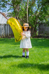 little girl enjoying nature in summer