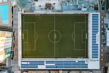Aerial top down view of football field in urban district in neighbourhood area, Valletta, Malta.