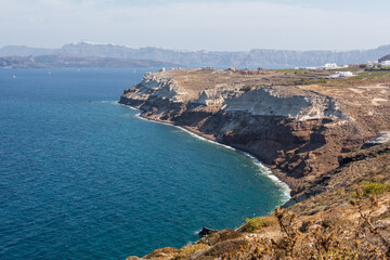 Fototapeta na wymiar Santorini cliffs. The peninsula of Akrotiri on the island of Santorini, Greece
