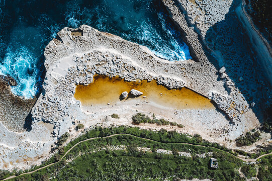 Aerial top down view of Mediterranean Sea coast near Malta.