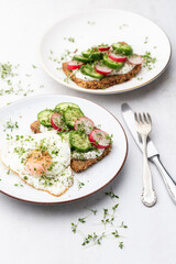 Keto Toasts with cucumber, egg, mozzarella and microgreens.