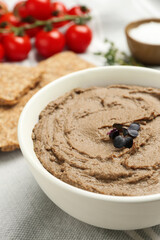 Tasty liver pate with herb in bowl on table, closeup