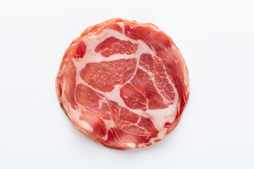 Italian prosciutto crudo or jamon. Raw ham. Isolated on white background.