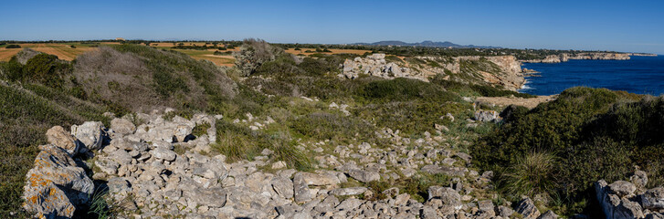 Fototapeta na wymiar Punta des Baus remains of the Talayotic settlement, Santanyi, southern cliffs -Migjorn cliffs-, Mallorca, Balearic Islands, Spain