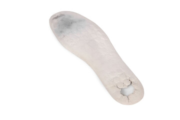 Old and shabby orthopedic insoles isolated on white background. Dirty leather insoles. Worn out things with holes. Inner soles of shoes. Top view banner close up