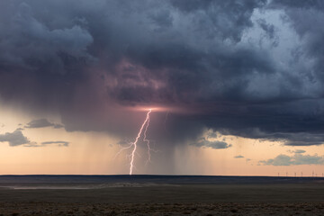 lightning and storm clouds at sunset