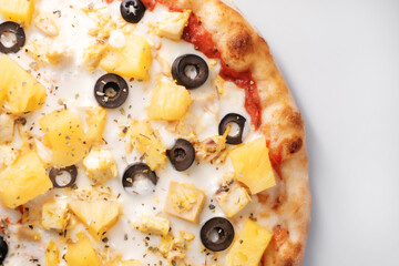 Italian pizza with pineapple and olives. The process of making pizza. Street food cooking concept.