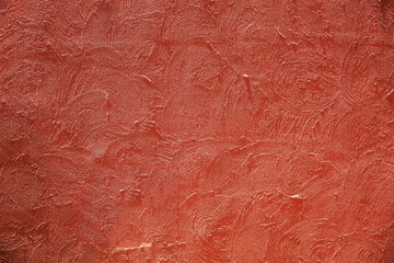 Fototapeta premium Photograph for background material taken from the front of a terracotta color plaster wall
