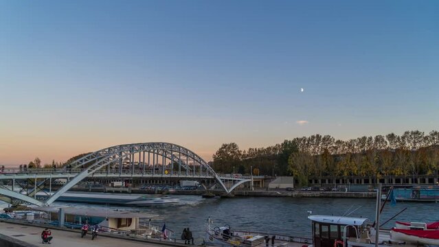 Pedestrian Bridge at Blue Hour With Peoples Walking On It Moon in the Sky Seine Docks