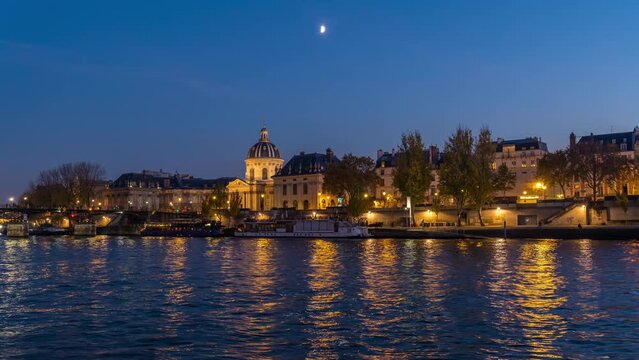 Parisian Architecture View From the Seine Docks at Blue Hour With Moonrise, Lights and Reflections