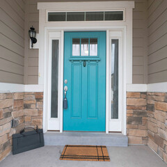 Square Turquiose front door with two side panels and white doorframe
