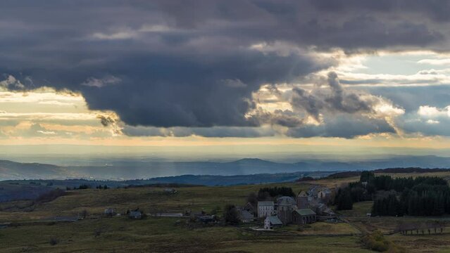 Stormy Clouds at the End of a Day Over Wide Lowlands With Shadows on the Landscape