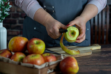 Women preparing delicious apple tart or pie large  on wood table background.