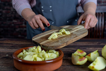 Women preparing delicious apple tart or pie large  on wood table background.