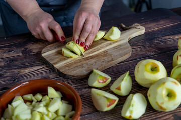 Women preparing delicious apple tart or pie large  on wood table background.