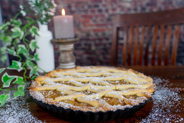 Delicious apple pie on wood table background.