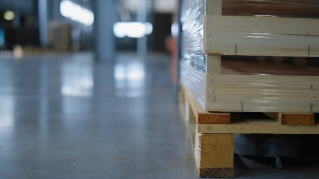 Storehouse vehicle pallets moving process factory production boxes close up