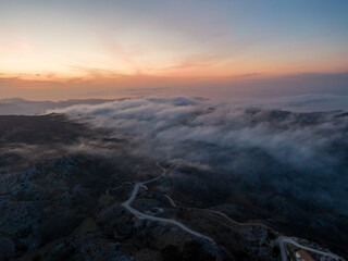 Aerial droen view of beautiful clouds with sunset  in mountain