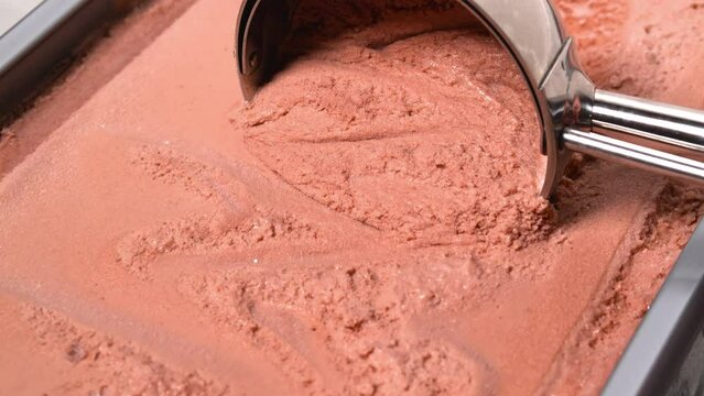 4K - Scooping up chocolate ice cream. Close-up
