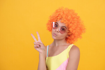 having fun. child wear sunglasses and swimsuit. teen girl with orange hair. summer beach fashion.