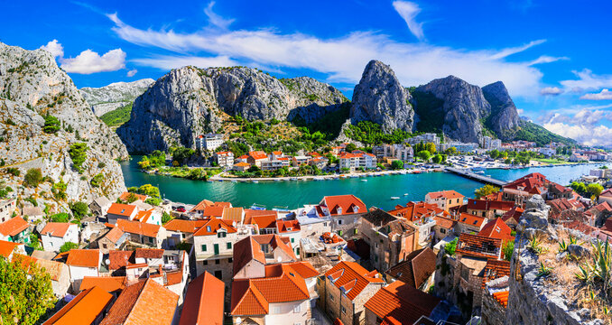 Landmarks of Croatia - impressive Omis town surrounded with mountain gorge, over Cetina river. Popular tousrit destination