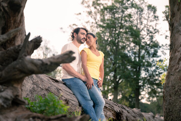 couple in love valentine's day, in sunny park on trunk