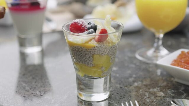 Huge healthy breakfast with juice, fruits, muesli, croissants,