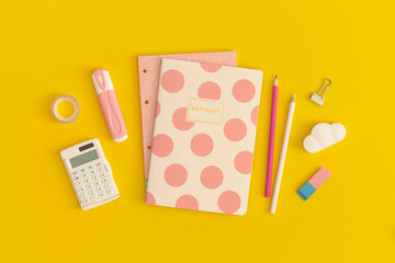 School stationery on a yellow background. Top view with copy space. Flat lay. Back to school concept.