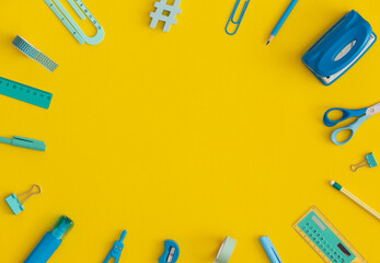 School stationery on a yellow background. Top view with copy space. Flat lay. Back to school concept.