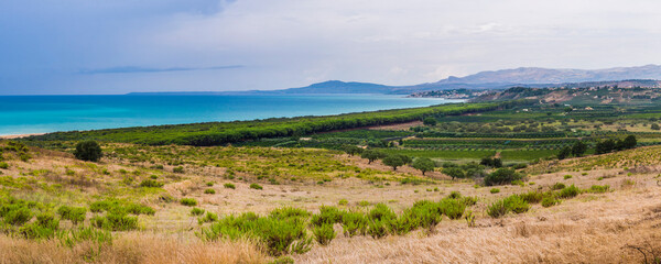 Panoramic photo of the Mediterranean Coast of Sicily seen from the Greek ruins of Heraclea Minoa, Agrigento Province, Sicily, Italy, Europe - obrazy, fototapety, plakaty