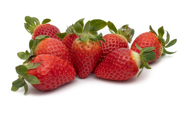 Fototapeta na wymiar A bunch of whole strawberries with their green leaves isolated on white background.
