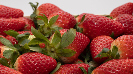 Some delicious background strawberries, freshly picked, and put in a wooden box. One of the largest harvests is produced in the province of Huelva, Spain.
