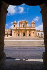 Noto, St Nicholas Cathedral (Cattedrale di Noto, Duomo), a Baroque building in Piazza Municipio seen from Noto Town Hall, Sicily, Italy, Europe