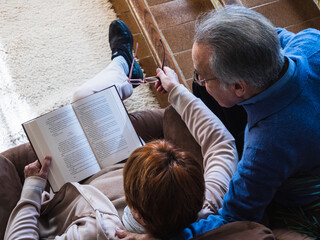 Marriage reading a book in a traditional house