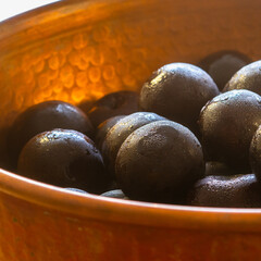 plums in copper pan