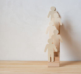 wooden figures on an miniature stair case (against a grungy background)