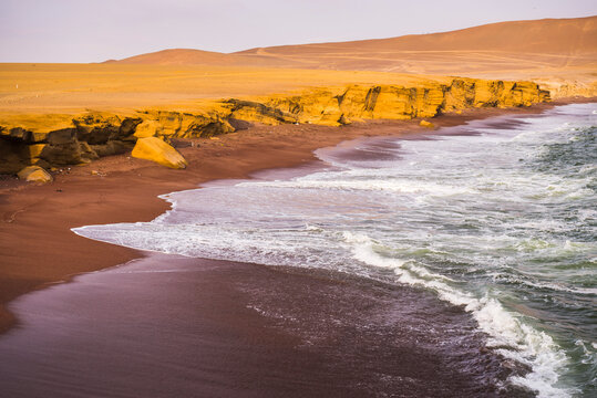 Desert directly meeting the sea (Pacific Ocean), Paracas National Reserve (Reserva Nacional de Paracas), Ica, Peru, South America