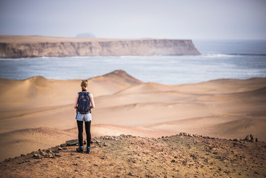 Tourist exploring Paracas National Reserve (Reserva Nacional de Paracas), Ica, Peru, South America