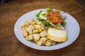 Traditional Peruvian food, a corn and cheese dish, Cusco, Peru, South America