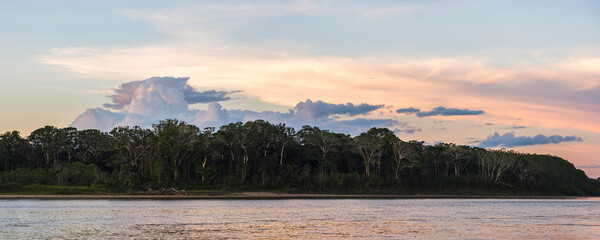 Sunset over river in Amazon Jungle of Peru, Tambopata National Reserve, Peru, South America