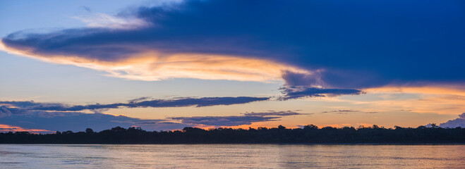 Sunset over river in Amazon Jungle of Peru, Tambopata National Reserve, Peru, South America