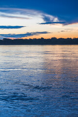 Fototapeta premium Sunset over river in Amazon Jungle of Peru, Tambopata National Reserve, Peru, South America
